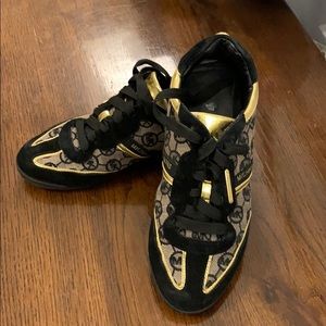 Michael lots black and gold sneakers size 71/2